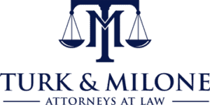 TURK & MILONE Attorneys at Law logo with scales of justice and initials TM.